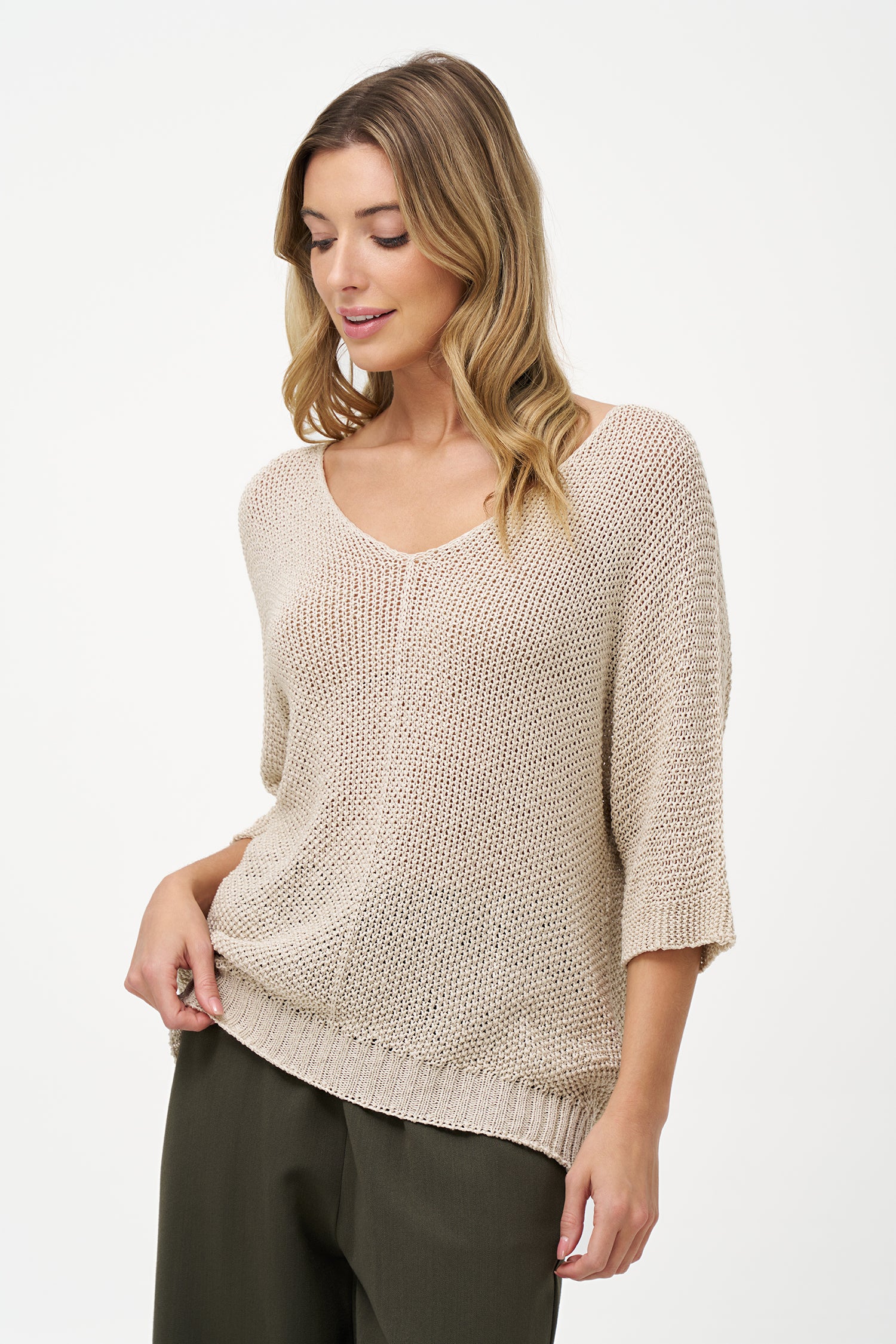 White acrylic knit sweater with elbow-length sleeves, scoop neckline, and textured semi-sheer finish for a relaxed, breathable look.