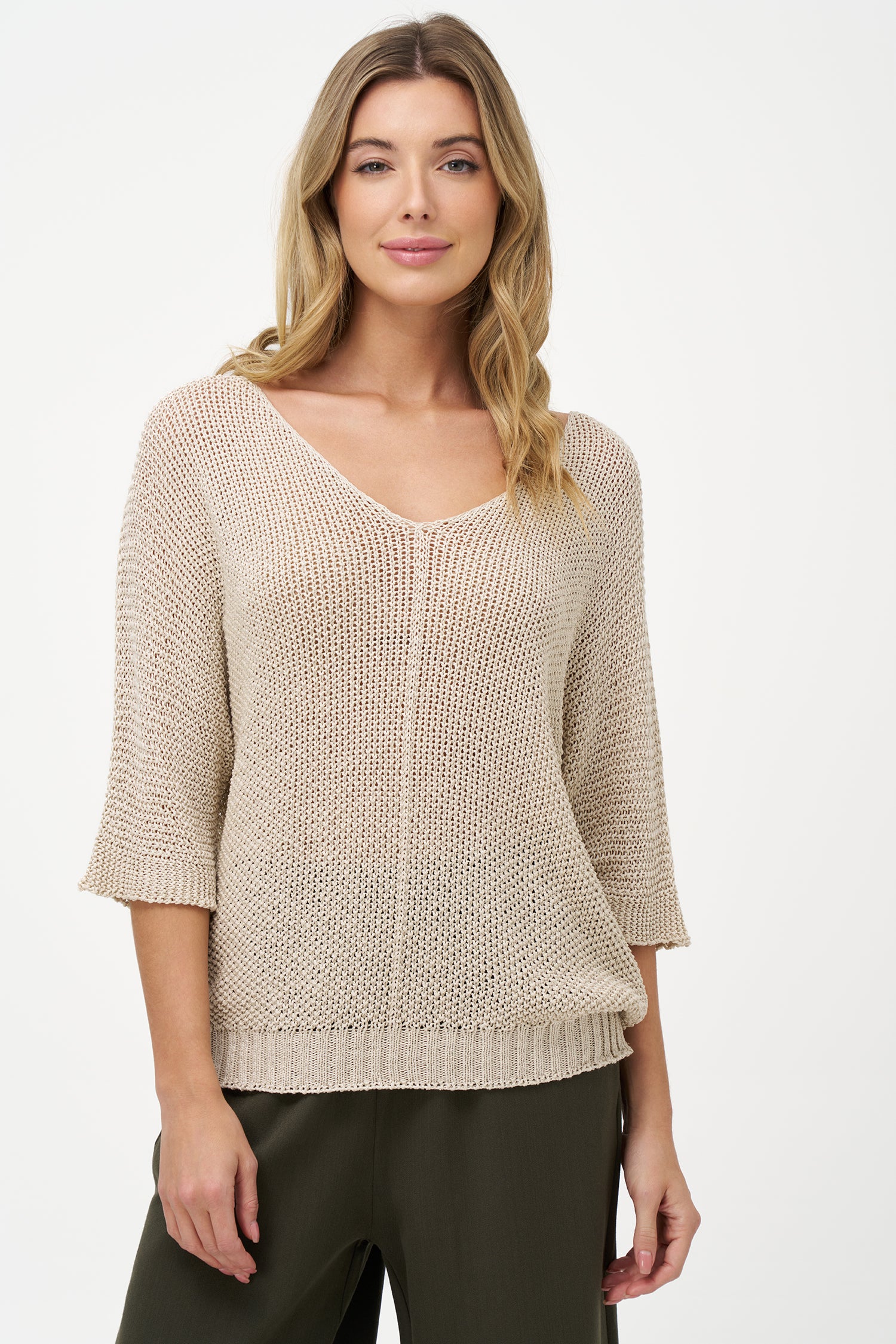 White acrylic knit sweater with elbow-length sleeves, scoop neckline, and textured semi-sheer finish for a relaxed, breathable look.