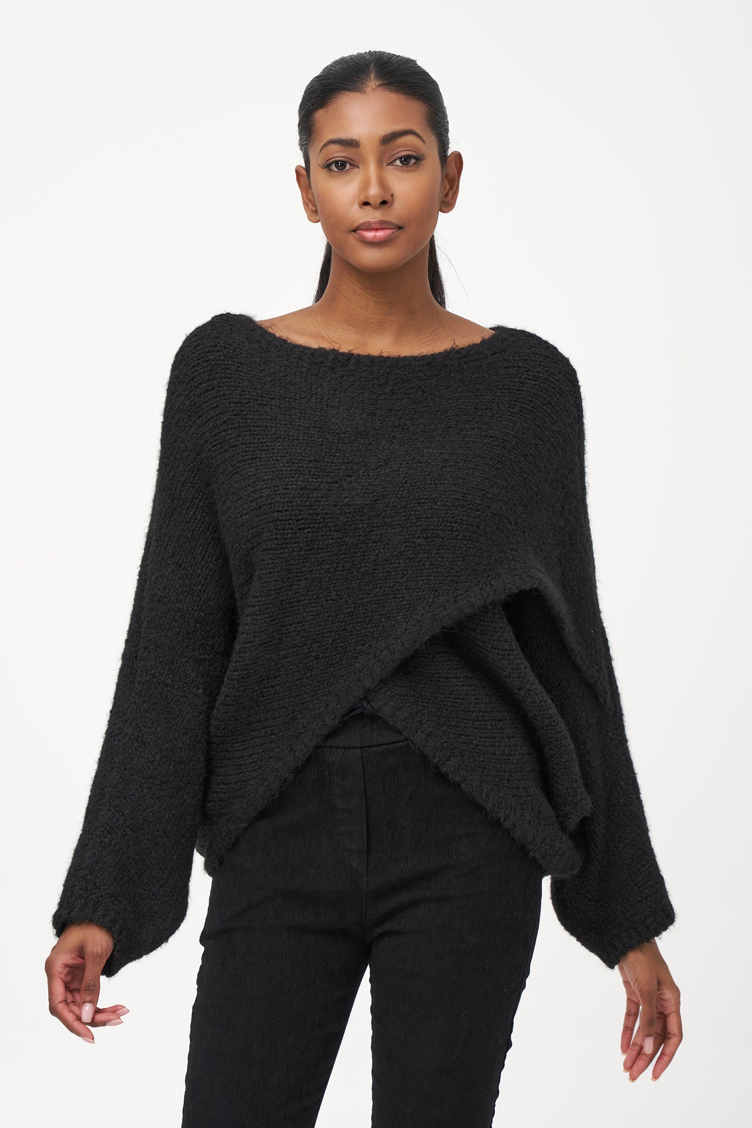 Black acrylic-blend sweater with a soft textured knit, long sleeves, and diagonal front overlay for a relaxed, stylish silhouette.