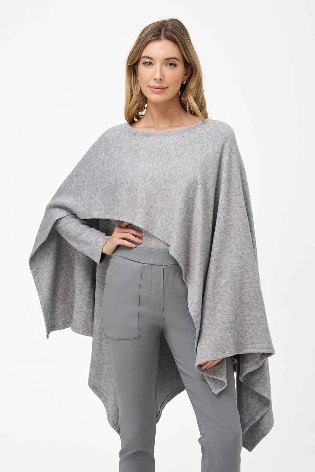Yellow viscose-blend asymmetrical poncho-style top with fluid drape, stretch fabric, and layered hemline for modern elegance.