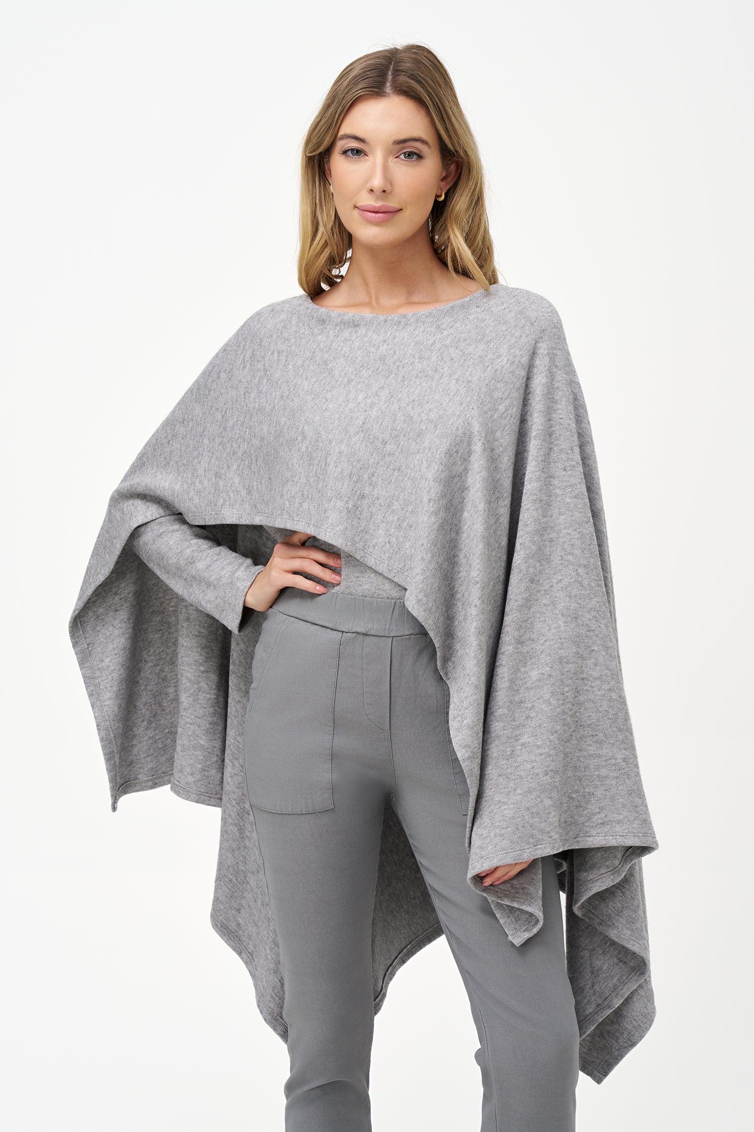 Yellow viscose-blend asymmetrical poncho-style top with fluid drape, stretch fabric, and layered hemline for modern elegance.