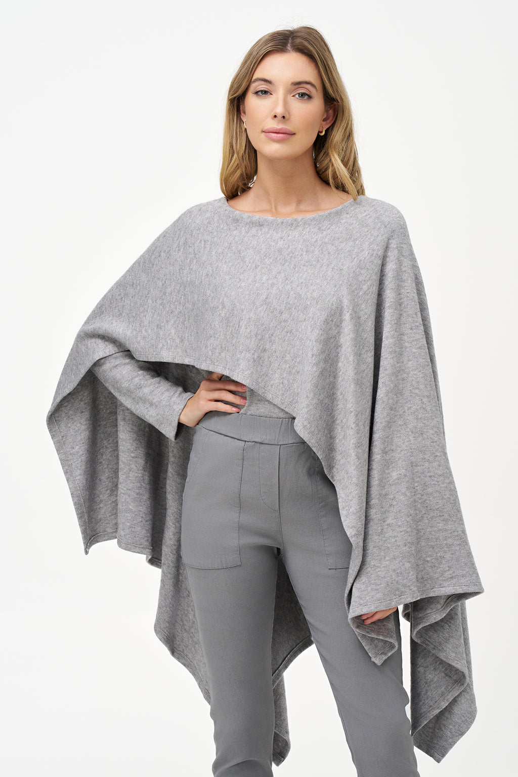 Yellow viscose-blend asymmetrical poncho-style top with fluid drape, stretch fabric, and layered hemline for modern elegance.