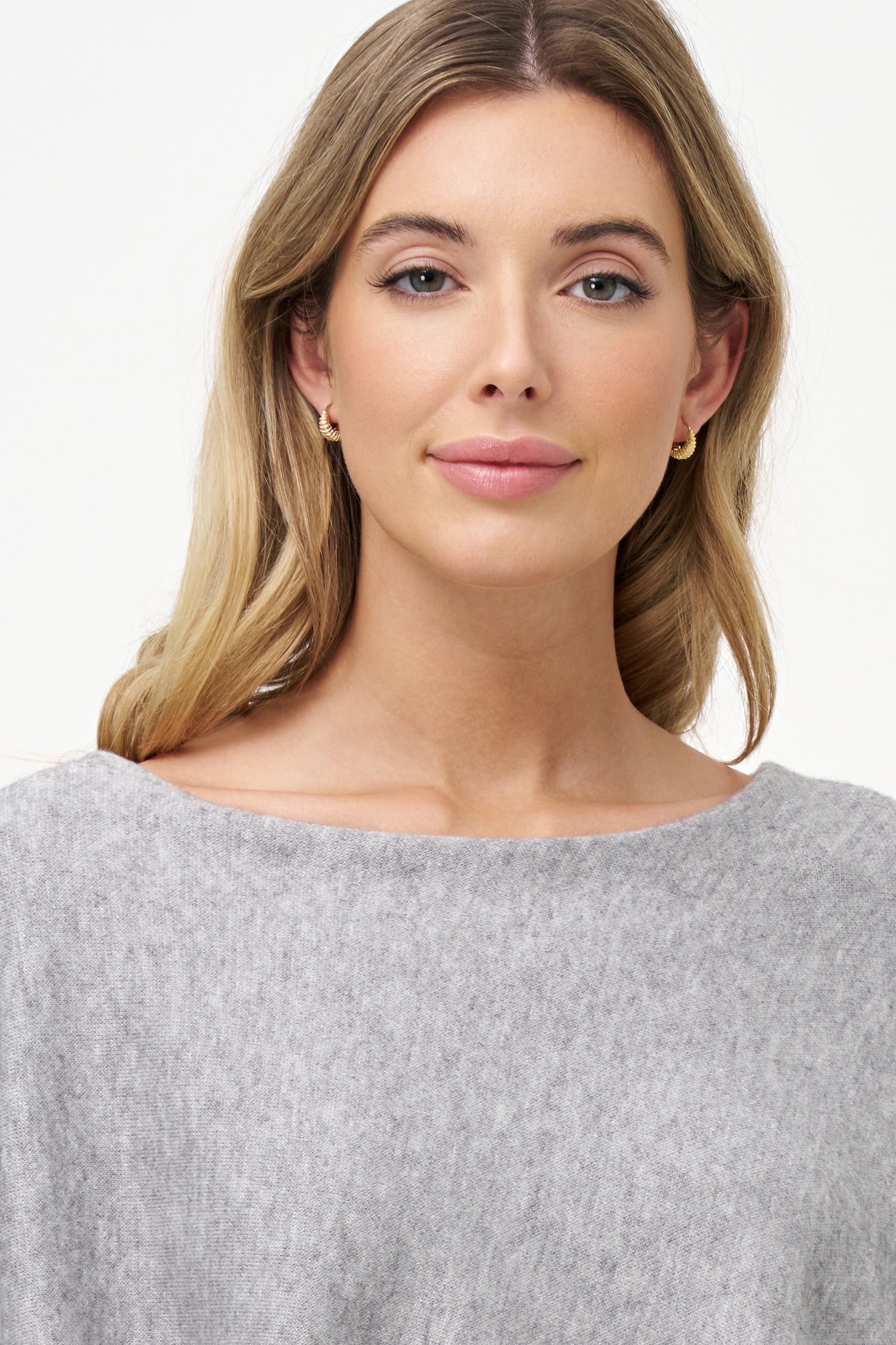 Yellow viscose-blend asymmetrical poncho-style top with fluid drape, stretch fabric, and layered hemline for modern elegance.