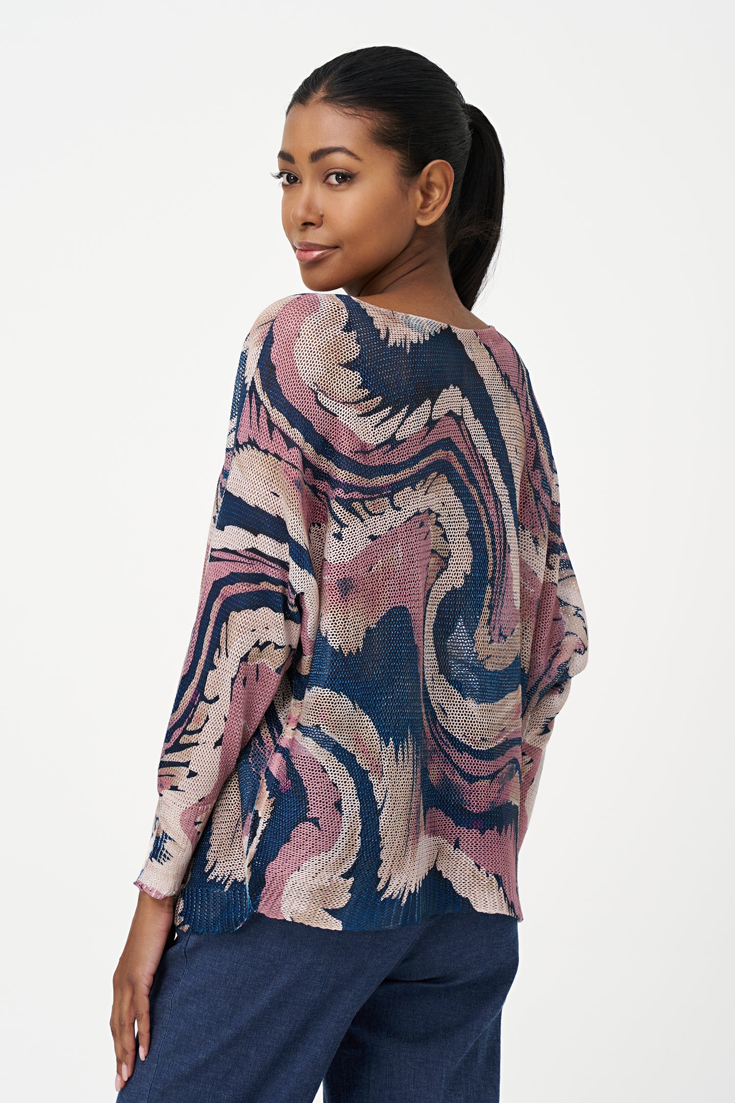 Long sleeve sweater with swirl print, round neckline and relaxed fit in Pink, black and blue tones