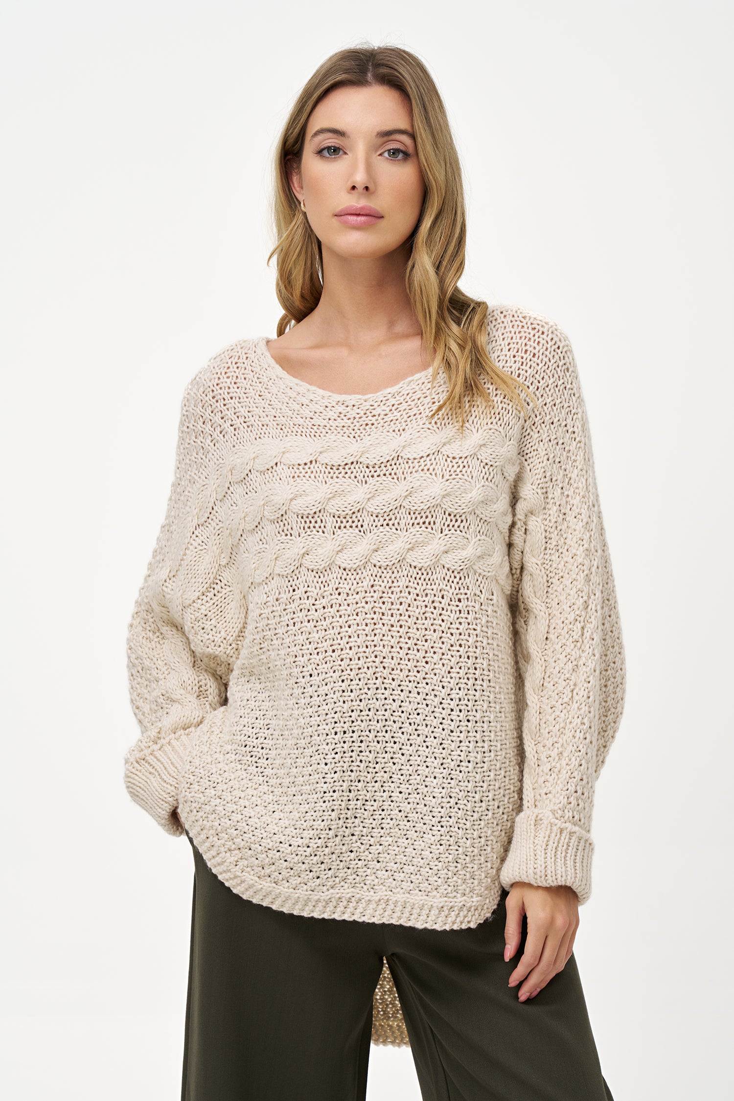 Cream White cable knit sweater with textured weave, round neck, and long sleeves, made of cozy acrylic wool blend with relaxed silhouette