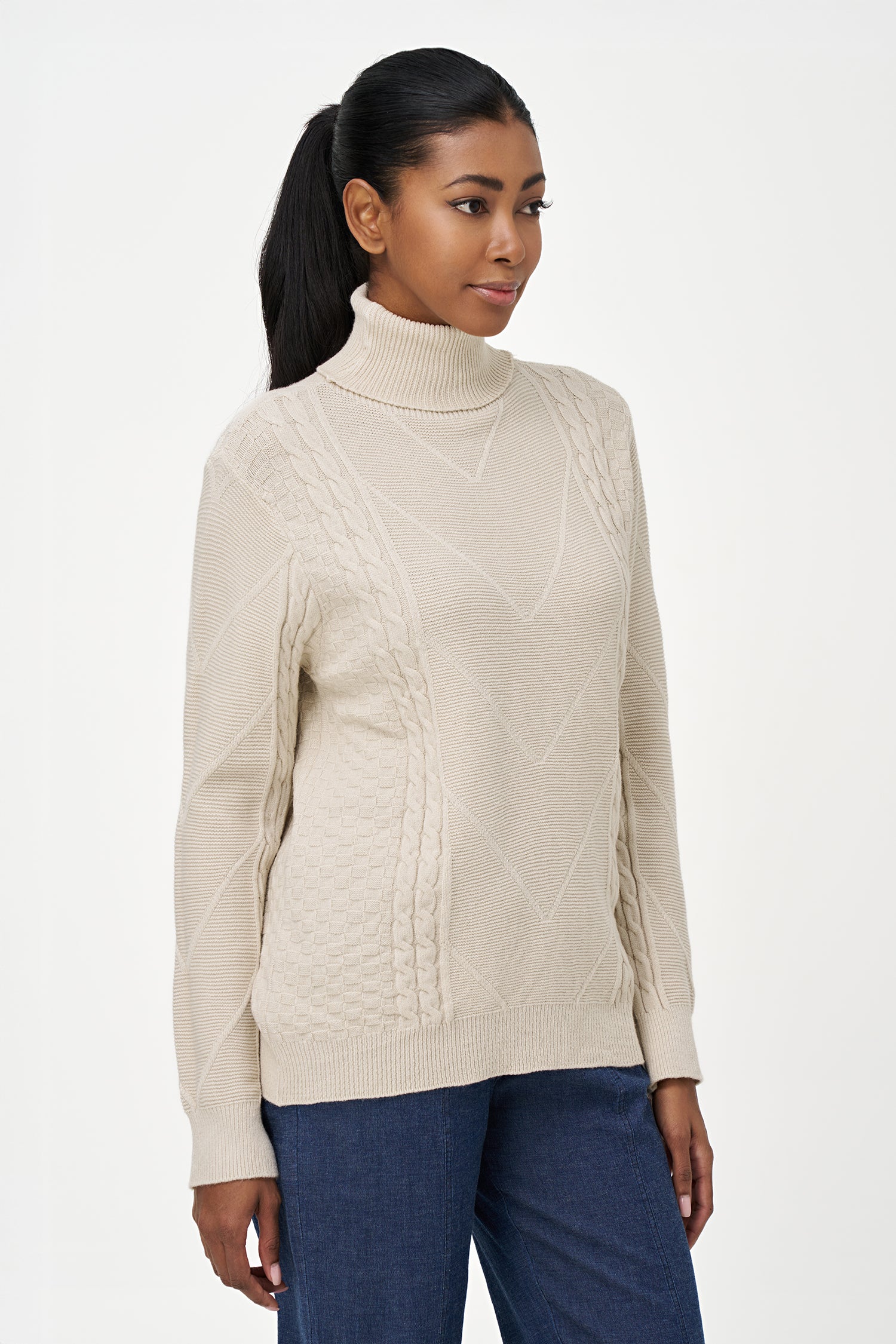 White turtleneck sweater with cable knit details and ribbed cuffs, crafted in a viscose blend for a cozy yet refined everyday look.