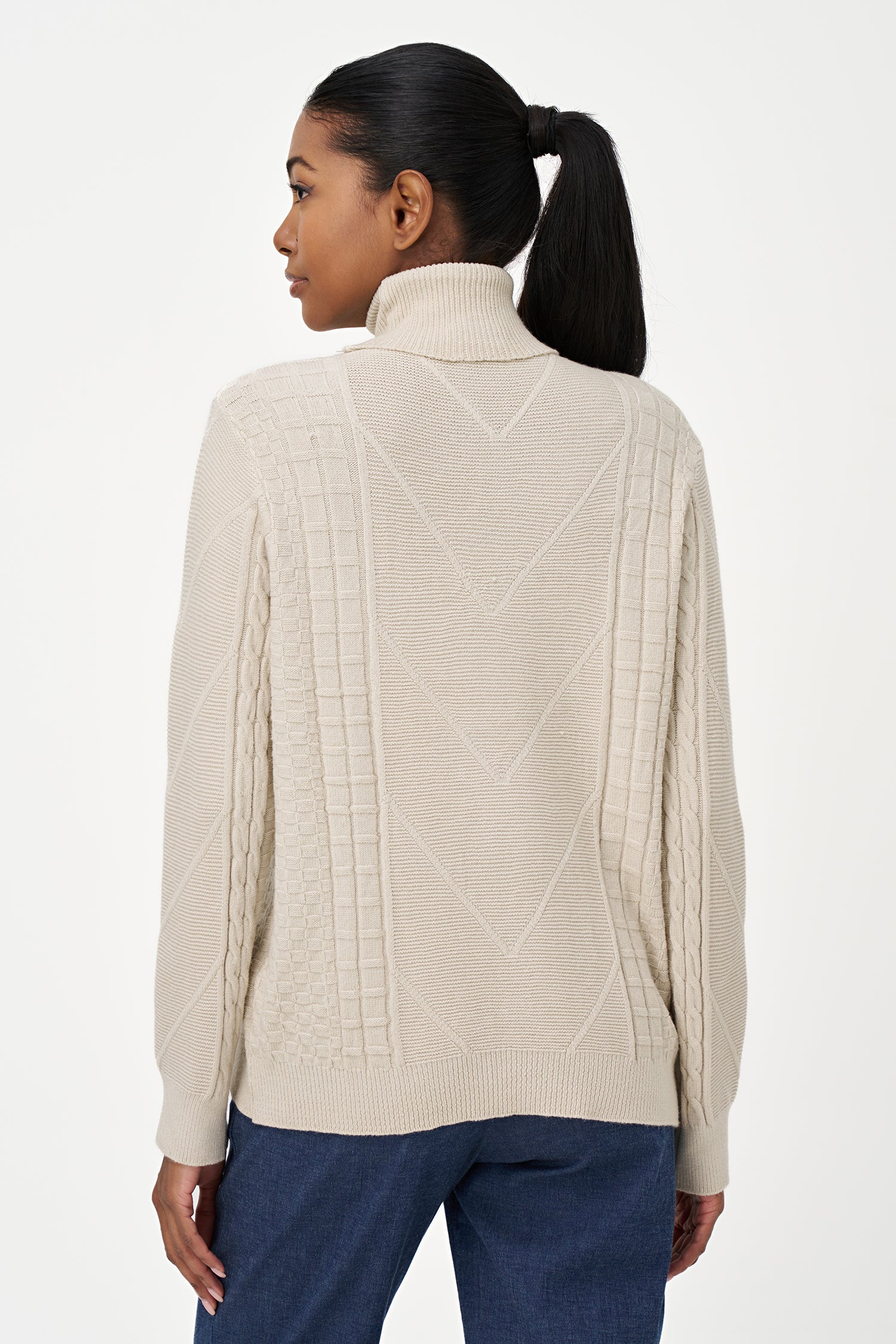 White turtleneck sweater with cable knit details and ribbed cuffs, crafted in a viscose blend for a cozy yet refined everyday look.