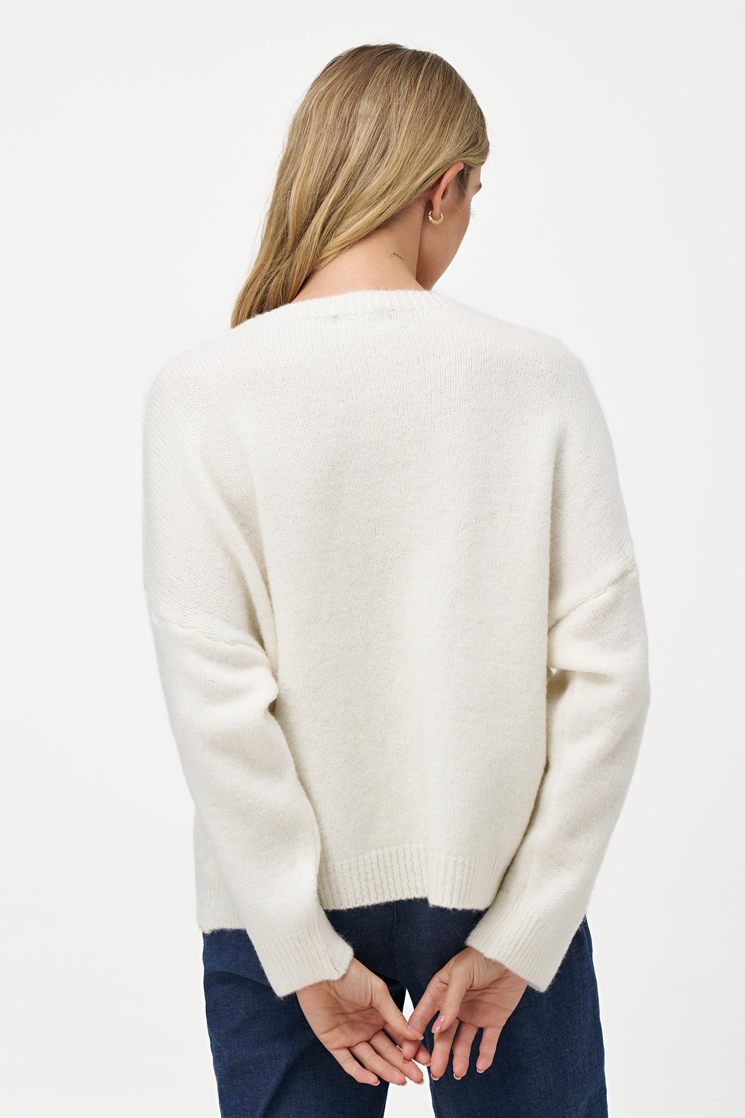 White Vanilla crewneck sweater with soft texture and red script design, ideal for casual outfits and everyday comfort.