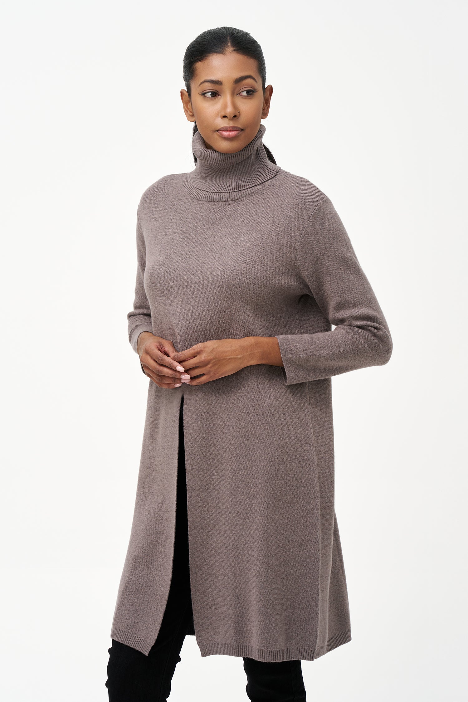 Long grey turtleneck knit tunic sweater with a clean front slit, tailored for comfort and layering with a modern, elegant silhouette.