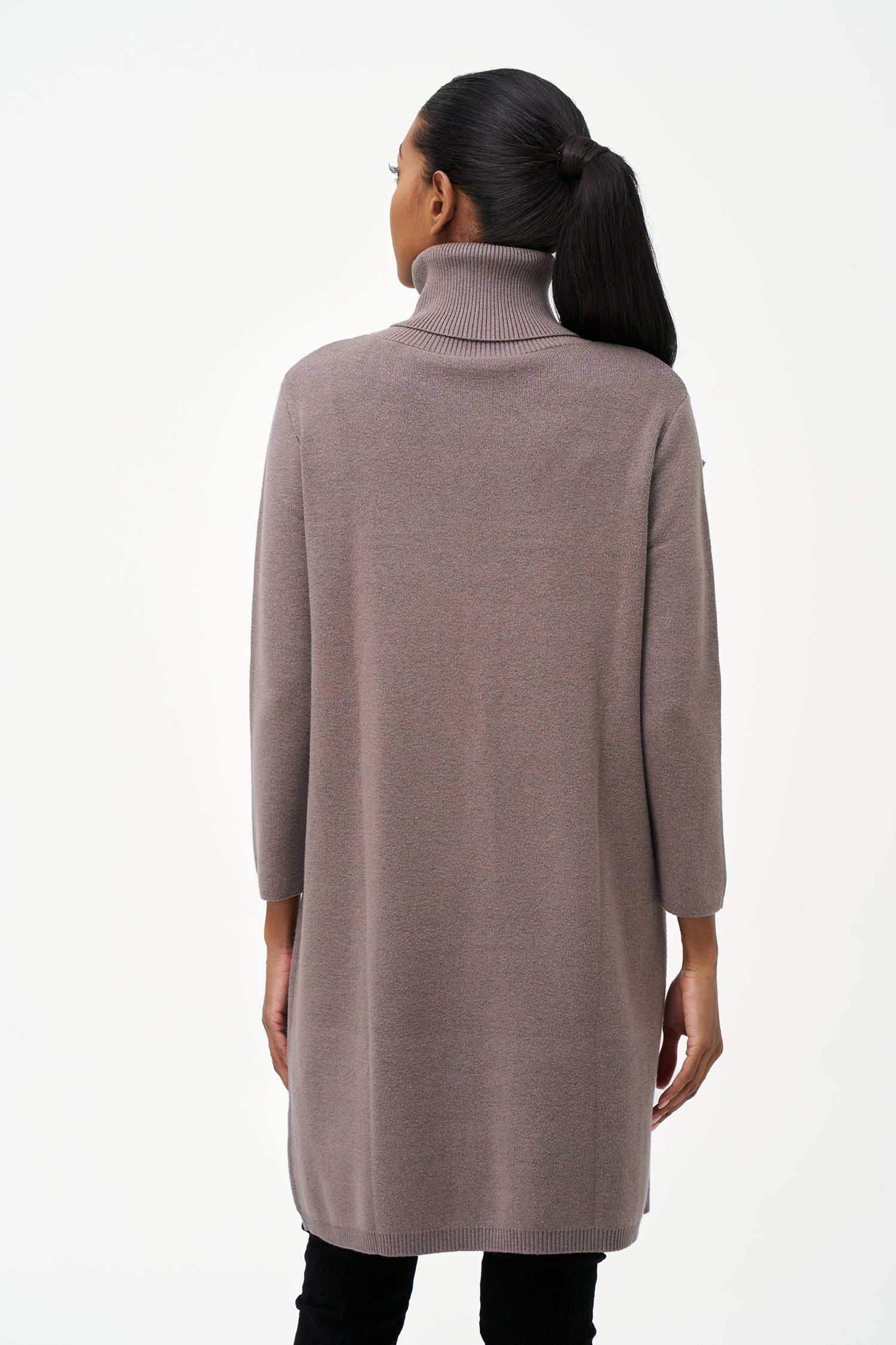 Long grey turtleneck knit tunic sweater with a clean front slit, tailored for comfort and layering with a modern, elegant silhouette.